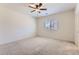 Neutral bedroom featuring carpet, a ceiling fan, and natural light from a window at 10837 W Bloch Rd, Tolleson, AZ 85353