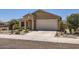 Attractive home with well-kept front yard, showcasing desert landscaping and a spacious two-car garage at 10837 W Bloch Rd, Tolleson, AZ 85353