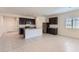 Modern kitchen featuring granite countertops, stainless steel appliances, and a breakfast bar at 10837 W Bloch Rd, Tolleson, AZ 85353