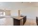 Well-appointed kitchen with granite countertops, a breakfast bar, and easy access to living areas at 10837 W Bloch Rd, Tolleson, AZ 85353