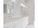 Bathroom featuring double sink vanity with white cabinets and marble countertop at 1228 N 106Th Pl, Mesa, AZ 85207
