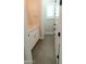 View of a bathroom with white trim, doors and vanity at 1228 N 106Th Pl, Mesa, AZ 85207
