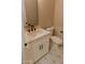 This charming bathroom is equipped with a modern faucet, stone counters, and sleek tile at 1228 N 106Th Pl, Mesa, AZ 85207