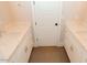 Bathroom featuring dual vanities with white cabinets and marble countertops at 1228 N 106Th Pl, Mesa, AZ 85207