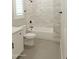 Bathroom featuring a modern vanity and bathtub shower combo at 1228 N 106Th Pl, Mesa, AZ 85207