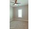 Neutral bedroom featuring wall-to-wall carpet, ceiling fan and window with light-filtering shutters at 1228 N 106Th Pl, Mesa, AZ 85207