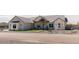 Beautiful exterior elevation featuring a quaint porch with stone and wooden posts, and desert landscaping at 1228 N 106Th Pl, Mesa, AZ 85207