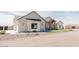 Single Gathering home with a two-car garage, desert landscaping, and modern architectural features at 1228 N 106Th Pl, Mesa, AZ 85207