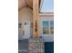 Exterior view of the house number on a post with dark hardware and brick base accents at 1228 N 106Th Pl, Mesa, AZ 85207