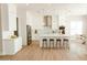 Spacious modern kitchen with stainless appliances, a large center island, and an open floor plan at 1228 N 106Th Pl, Mesa, AZ 85207