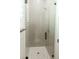 Modern shower with subway tile and glass door enclosure at 1228 N 106Th Pl, Mesa, AZ 85207