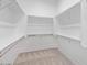 Walk-in closet featuring built-in shelving and ample storage space at 1228 N 106Th Pl, Mesa, AZ 85207