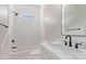 Bright bathroom featuring a white subway tile shower and modern black fixtures at 1229 N 106Th Pl, Mesa, AZ 85207