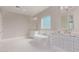 Bright bathroom featuring a freestanding tub, double vanities, and modern fixtures at 1229 N 106Th Pl, Mesa, AZ 85207
