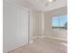 Cozy bedroom featuring plush carpeting, natural light, and ample closet space at 1229 N 106Th Pl, Mesa, AZ 85207
