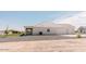 A view of the side and back of the house showing the spacious three car garage at 1229 N 106Th Pl, Mesa, AZ 85207