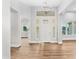 Elegant foyer with wood floors, chandelier, and lots of natural light at 1229 N 106Th Pl, Mesa, AZ 85207