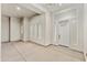 Bright and spacious entrance area, featuring a modern door and large windows at 1229 N 106Th Pl, Mesa, AZ 85207