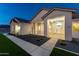 Inviting single-story home featuring stone accents and a covered porch at 1229 N 106Th Pl, Mesa, AZ 85207