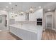 Elegant kitchen features a large center island and stainless steel appliances at 1229 N 106Th Pl, Mesa, AZ 85207
