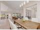 Bright, open-concept living room featuring a dining area and modern decor, perfect for entertaining and relaxed living at 1229 N 106Th Pl, Mesa, AZ 85207