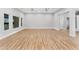 Spacious living room with wood floors and multiple windows for ample natural light at 1229 N 106Th Pl, Mesa, AZ 85207
