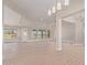 Large open concept living room with ample natural light and wood flooring at 1229 N 106Th Pl, Mesa, AZ 85207