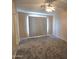 Cozy bedroom with soft carpeting and a ceiling fan for added comfort at 1264 W 6Th Ave, Apache Junction, AZ 85120