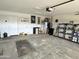 Spacious two car garage featuring a concrete floor and lots of room for storage at 1264 W 6Th Ave, Apache Junction, AZ 85120