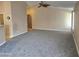 The inviting living room features high ceilings and neutral paint palette at 1264 W 6Th Ave, Apache Junction, AZ 85120