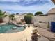 Inviting pool area with a waterfall feature and lush landscaping at 1264 W 6Th Ave, Apache Junction, AZ 85120