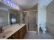 Bright bathroom features a double sink vanity and a glass-enclosed shower at 1320 E Bellerive Dr, Chandler, AZ 85249