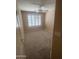 This carpeted bedroom features bright, natural light and a ceiling fan at 1320 E Bellerive Dr, Chandler, AZ 85249