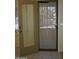Open doorway featuring a door with blinds and a security screen at 1320 E Bellerive Dr, Chandler, AZ 85249