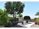 View of landscaped yard and the home’s screened-in patio, highlighting the blend of indoor and outdoor living at 1320 E Bellerive Dr, Chandler, AZ 85249