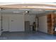 The spacious garage features ample storage solutions, including built-in cabinets, enhancing organization and utility at 1320 E Bellerive Dr, Chandler, AZ 85249