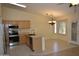 Bright kitchen featuring stainless steel appliances, an island sink, and an attached breakfast nook at 1320 E Bellerive Dr, Chandler, AZ 85249