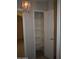 Open pantry features multiple shelves for organized storage near a chandelier at 1320 E Bellerive Dr, Chandler, AZ 85249