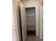 Open pantry features multiple shelves for organized storage behind a door at 1320 E Bellerive Dr, Chandler, AZ 85249