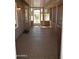 The screened-in patio allows for ample natural light, a screen door, and epoxy floors at 1320 E Bellerive Dr, Chandler, AZ 85249