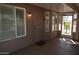 The enclosed patio provides an outdoor living space, featuring a secure screen door and window with shutters at 1320 E Bellerive Dr, Chandler, AZ 85249