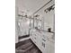 Contemporary bathroom featuring a double sink vanity, large mirrors, and a glass enclosed shower at 1401 S Rita Ln, Tempe, AZ 85281