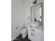 Modern half bathroom with white vessel sink, marble countertop, and sleek black fixtures at 1401 S Rita Ln, Tempe, AZ 85281