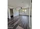 Bedroom featuring sliding door, hardwood floors, a ceiling fan, and bright natural light at 1401 S Rita Ln, Tempe, AZ 85281