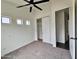 Bedroom with a large window, ceiling fan, and a sliding door closet at 1401 S Rita Ln, Tempe, AZ 85281