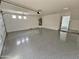 Large three-car garage with epoxy flooring and ample space for storage at 1401 S Rita Ln, Tempe, AZ 85281