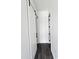 Hallway with a sliding barn door and dark wood floors at 1401 S Rita Ln, Tempe, AZ 85281