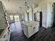 Spacious kitchen with an island, stainless steel appliances, and an open view to the living area at 1401 S Rita Ln, Tempe, AZ 85281