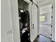 Laundry area featuring a stacked washer and dryer and a barn door entry to another room at 1401 S Rita Ln, Tempe, AZ 85281