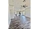 Open living room with dark wood floors and a view of the modern kitchen at 1401 S Rita Ln, Tempe, AZ 85281